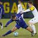 Wolverines forward James Murphy aggressively plays against the Purple Eagles Rene De Zorzi during the first half of Thursday nights game.Courtney Sacco I AnnArbor.com    
